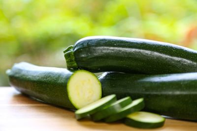 Close-up of courgettes on cutting board
