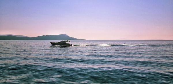 Scenic view of sea against clear sky during sunset