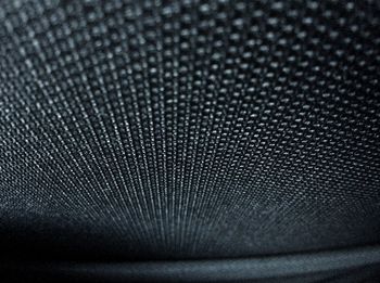 Close-up of electric fan against black background