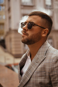 Portrait of young man wearing sunglasses