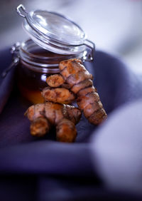 Close-up of meat in jar on table