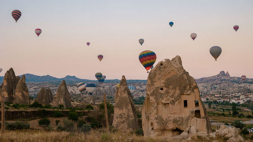 Hot air balloons flying against sky