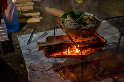 Cooking pot on the fire at night