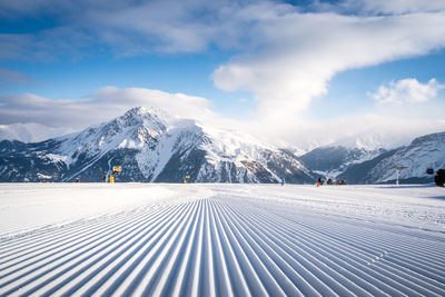 Scenic view of snowcapped mountains against sky