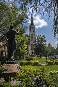 Basilica of the sacred heart with statue in foreground