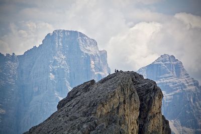 Low angle view of snowcapped mountain against sky