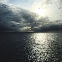 Scenic view of sea against cloudy sky