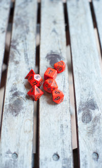 Red dices on wooden table
