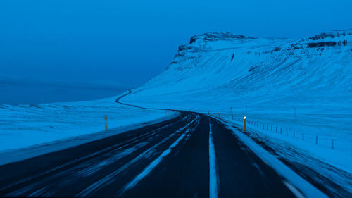 Scenic view of snow covered landscape against sky