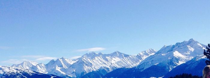 Scenic view of snow covered mountains against sky