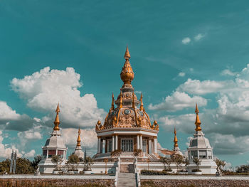 View of temple building against cloudy sky