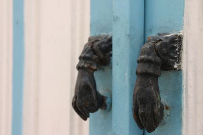 Close-up of rusty metal door knocker