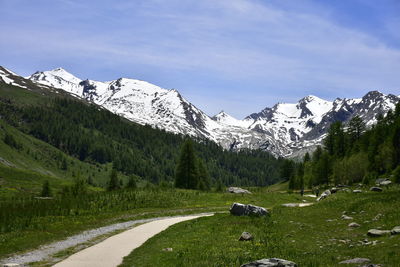 Scenic view of snowcapped mountains against sky