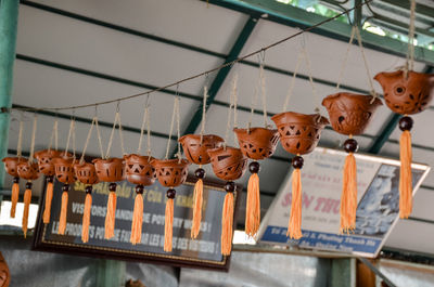 Low angle view of stuffed toy hanging at market stall