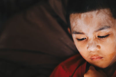 Close-up of boy with face paint at home