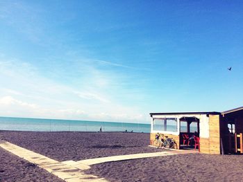 View of beach against blue sky