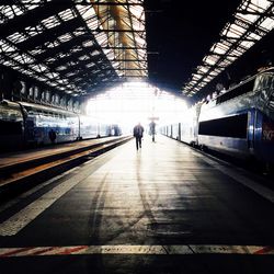 People walking on railroad track