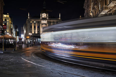 Light trails on railroad tracks at night