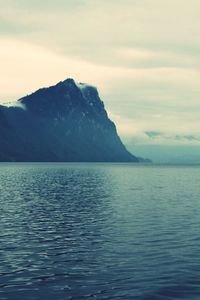 Scenic view of mountains against cloudy sky