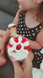 Midsection of girl holding ice cream