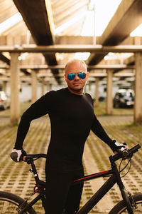 Portrait of man cycling on bicycle