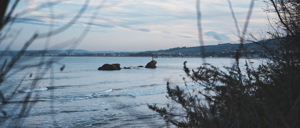 Scenic view of sea against sky during winter