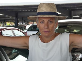 Portrait of young man in car