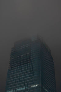 Low angle view of buildings in city against sky