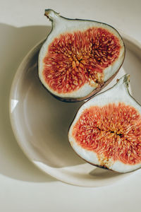 High angle view of fruits in plate on table