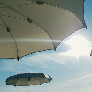 Low angle view of umbrella against sky