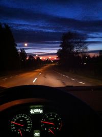 Car moving on highway at night