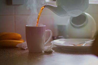 Close-up of coffee cup on table