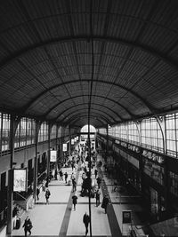 People walking on railroad station platform