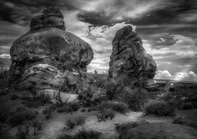 Low angle view of rocks against sky