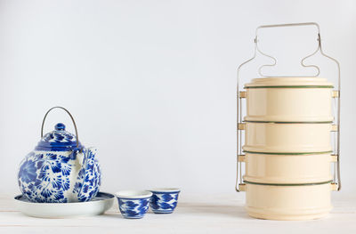 Close-up of drink on table against white background