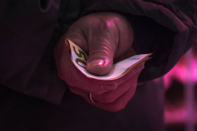 Close-up of hand holding paper currency