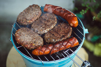 Close-up of sausages on barbecue grill