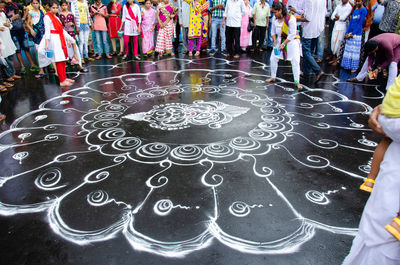 High angle view of people standing on street