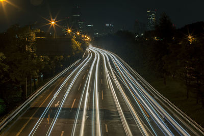 High angle view of light trails on street at night