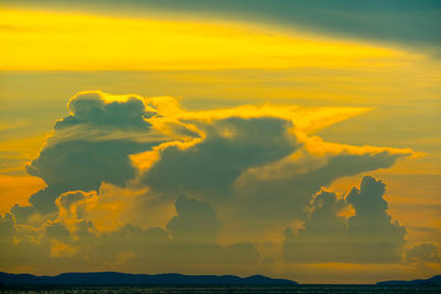 Scenic view of dramatic sky over sea during sunset