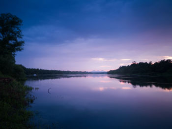 Scenic view of river against sky during sunset