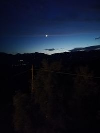 Scenic view of silhouette mountain against sky at night