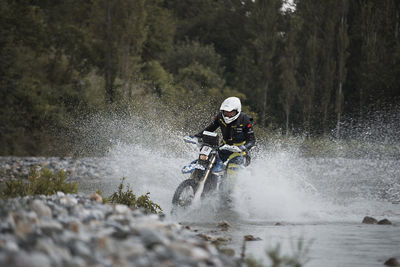 Man riding bicycle on water