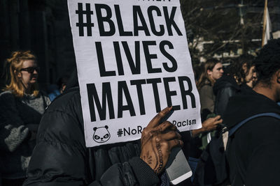 Man holding banner during protest