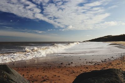 Scenic view of beach against sky