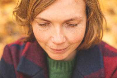 Close-up portrait of a smiling young woman