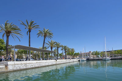 Scenic view of swimming pool against clear blue sky