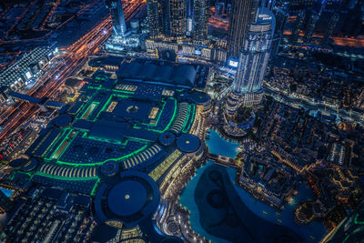 High angle view of illuminated buildings in city at night