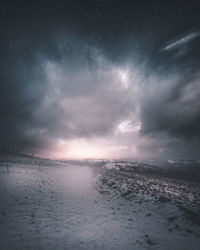 Scenic view of sea against sky at night