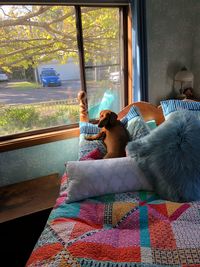 Woman relaxing on bed at home